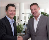 Udo Müller, Vorstandsvorsitzender von Ströer SE (li.) und Niek Jan van Damme, Vorstandsmitglied der Deutschen Telekom AG 